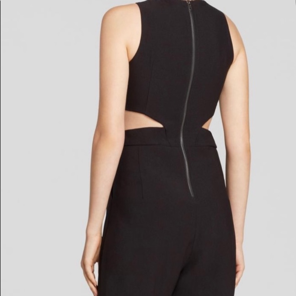 Lucy Paris, black pant suit w/ pockets.